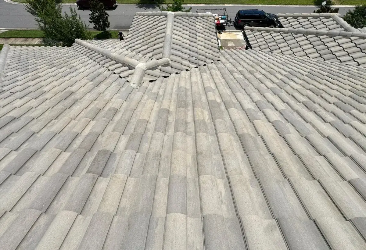 The same tile roof clean and streak-free after roof soft washing